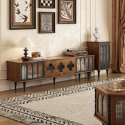 Mid cenrury Tv stand in a living room setting with decorative items and wall art.